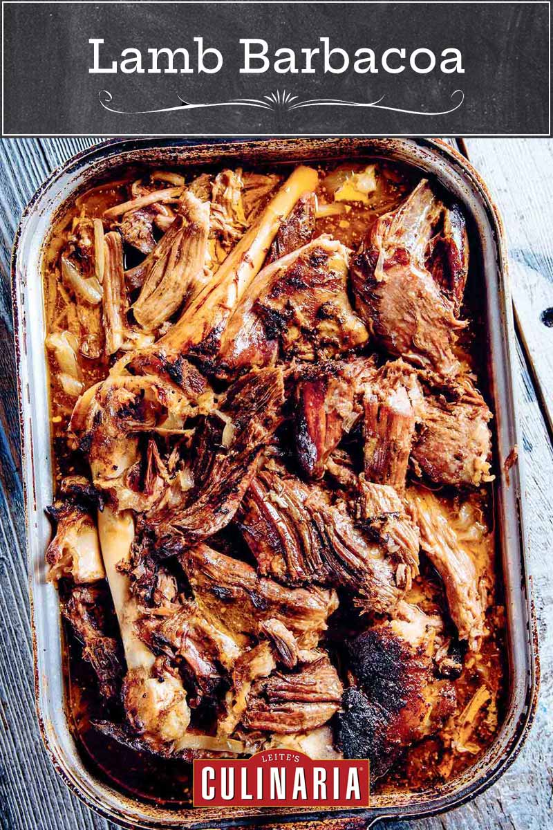 A deep roasting pan filled with shredded lamb barbacoa.