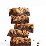 A stack of five chocolate chip cookie brownies.