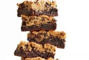 A stack of five chocolate chip cookie brownies.