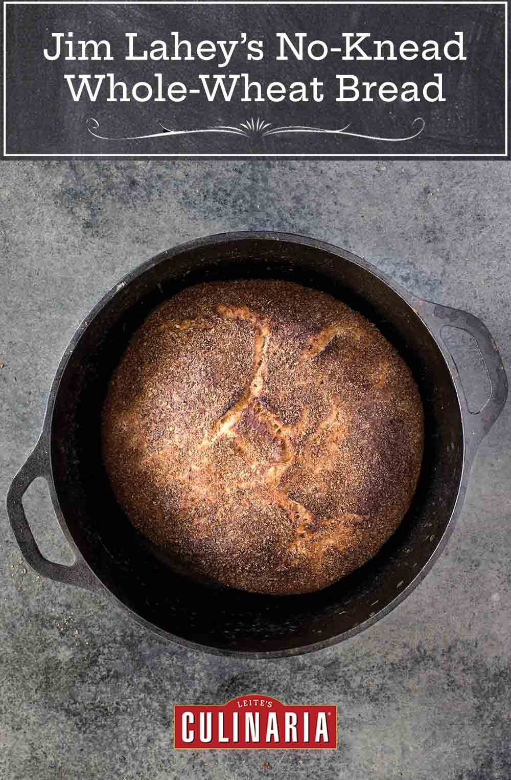 Cast-iron pot with a loaf of Jim Lahey's no-knead whole-wheat bread on a gray background