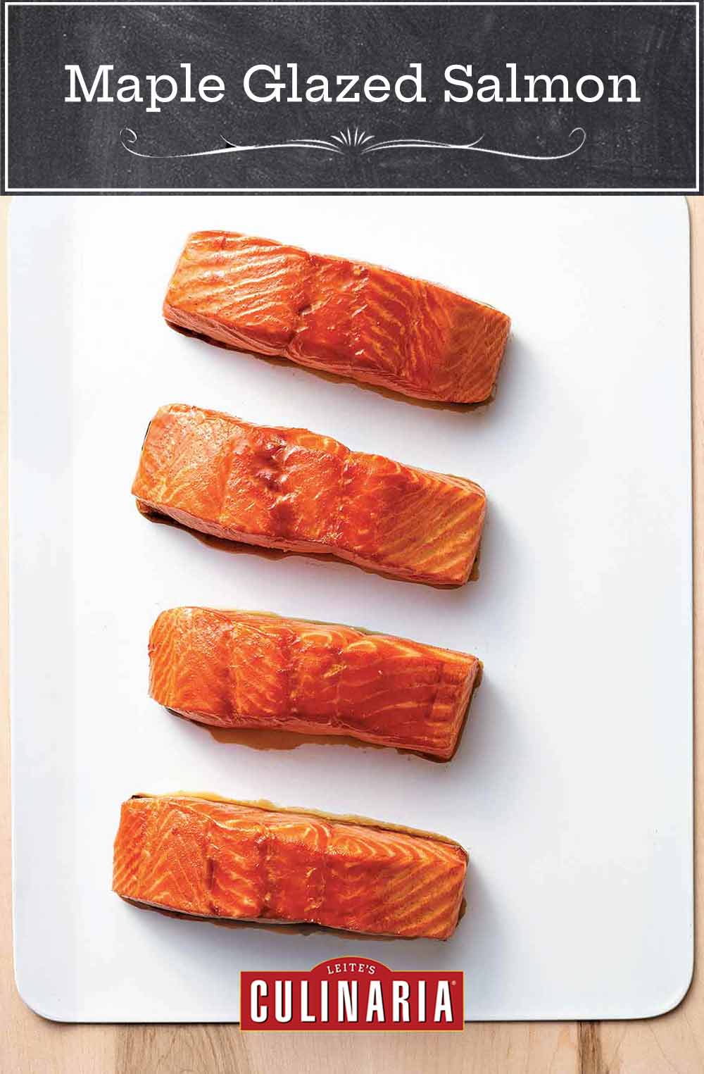 Four fillets of maple glazed salmon of a white square platter