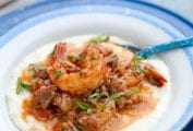 A blue and white bowl filled with shrimp and grits.