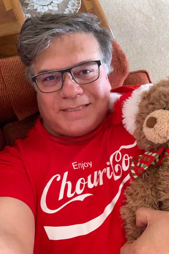 David is enjoying some down-home hygge wearing his favorite t-shirt while snuggled on the couch with a stuffed animal.