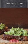 Three pieces of bread topped with fava bean puree.