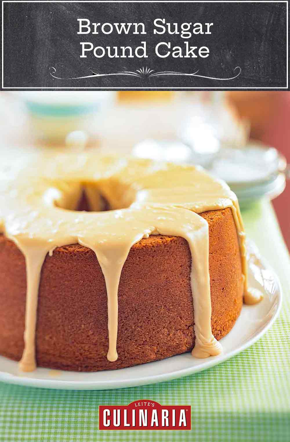 A frosted brown sugar pound cake on a white plate on a cloth-covered picnic table.