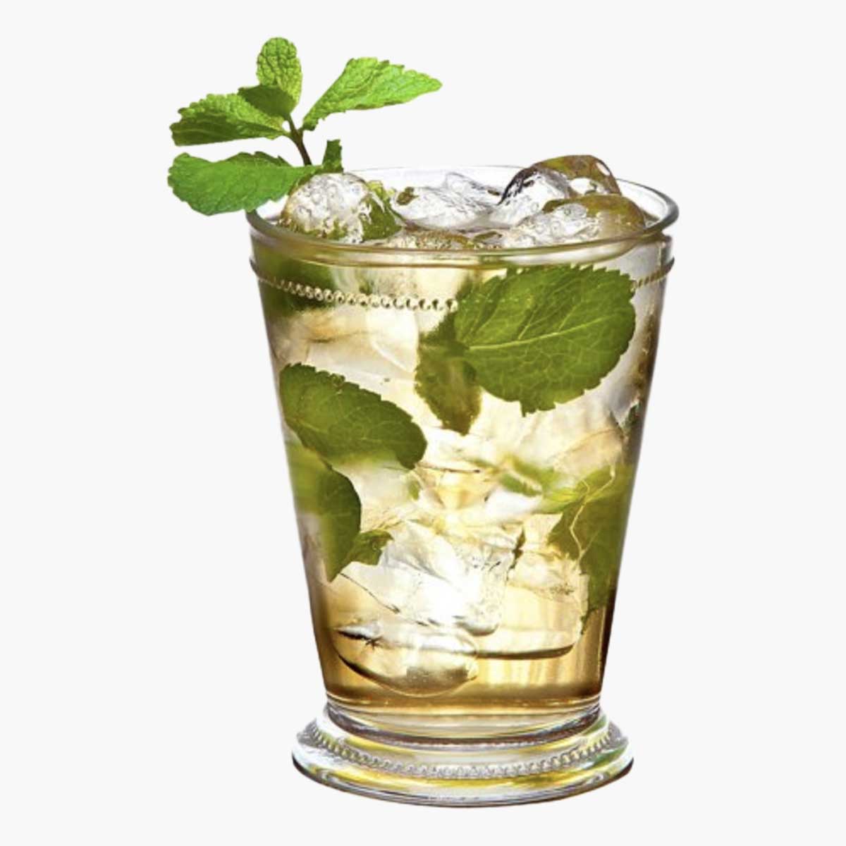 A crystal mint julep cup filled with ice, mint, and liquid.