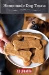 A person holding a white platter filled with homemade dog treats and a dog looking at them.