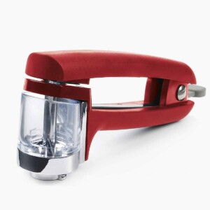 A red OXO cherry and olive pitter.