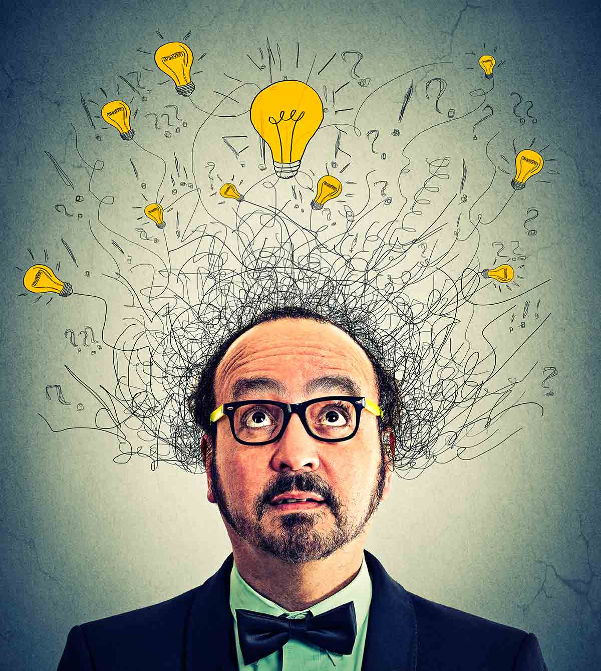 A questioning man with illustrations of lightbulb swirling above his head.