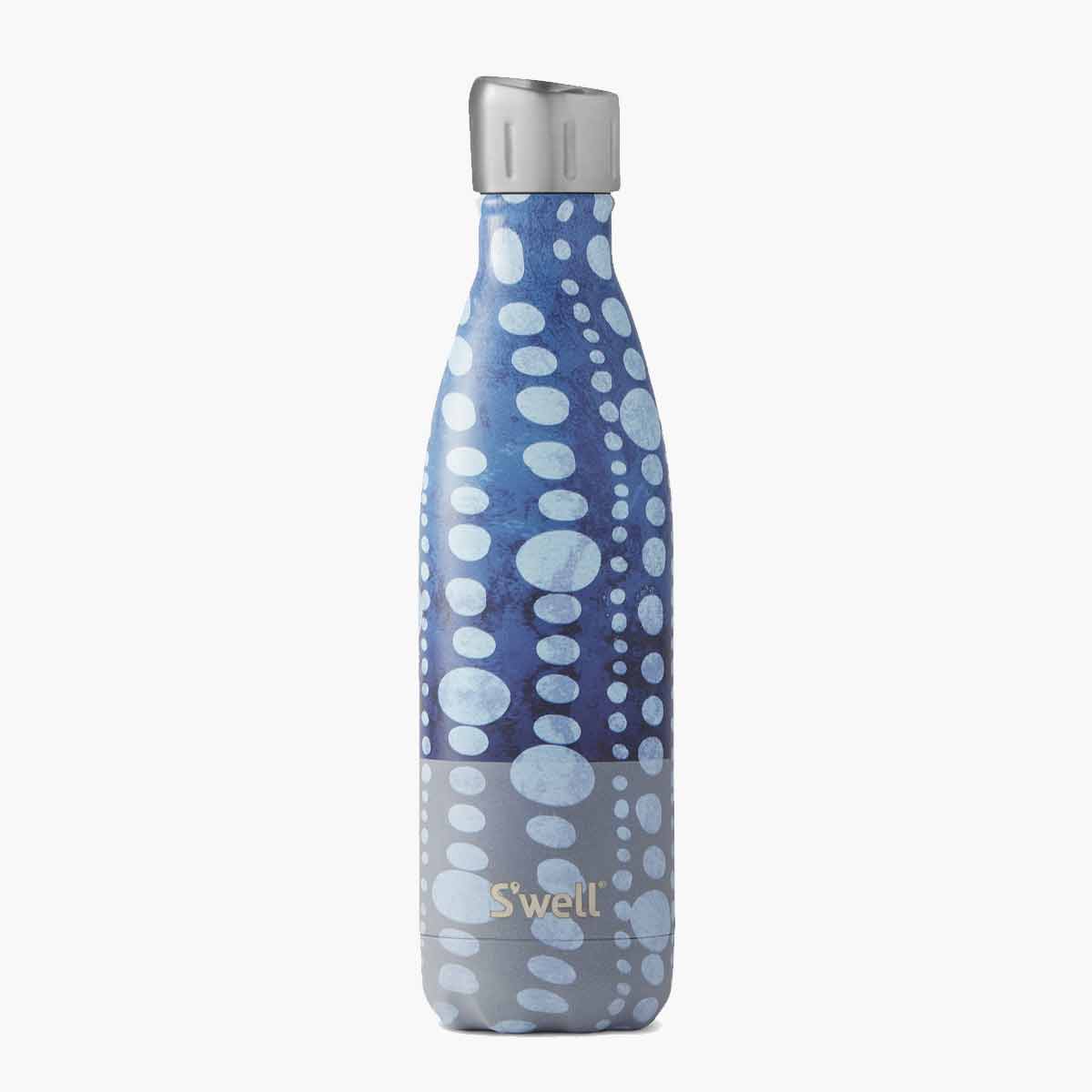 A blue and white polka dot patterned S'well water bottle.