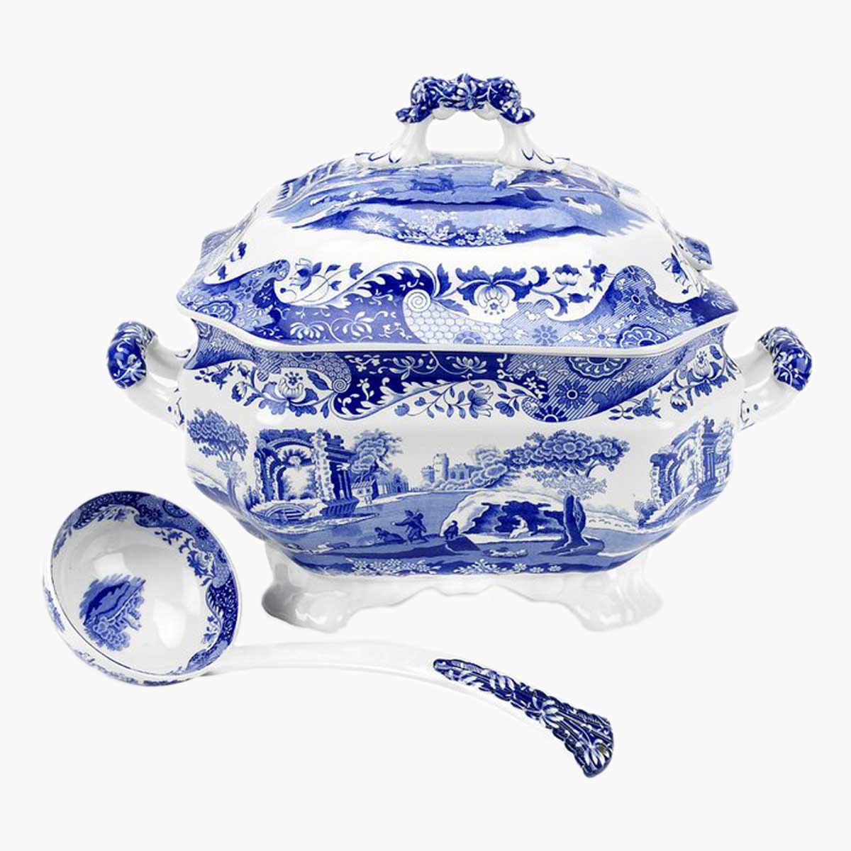A decorative blue and white soup tureen, bowl, and ladle.