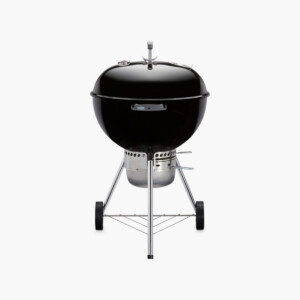A black Weber kettle charcoal grill.