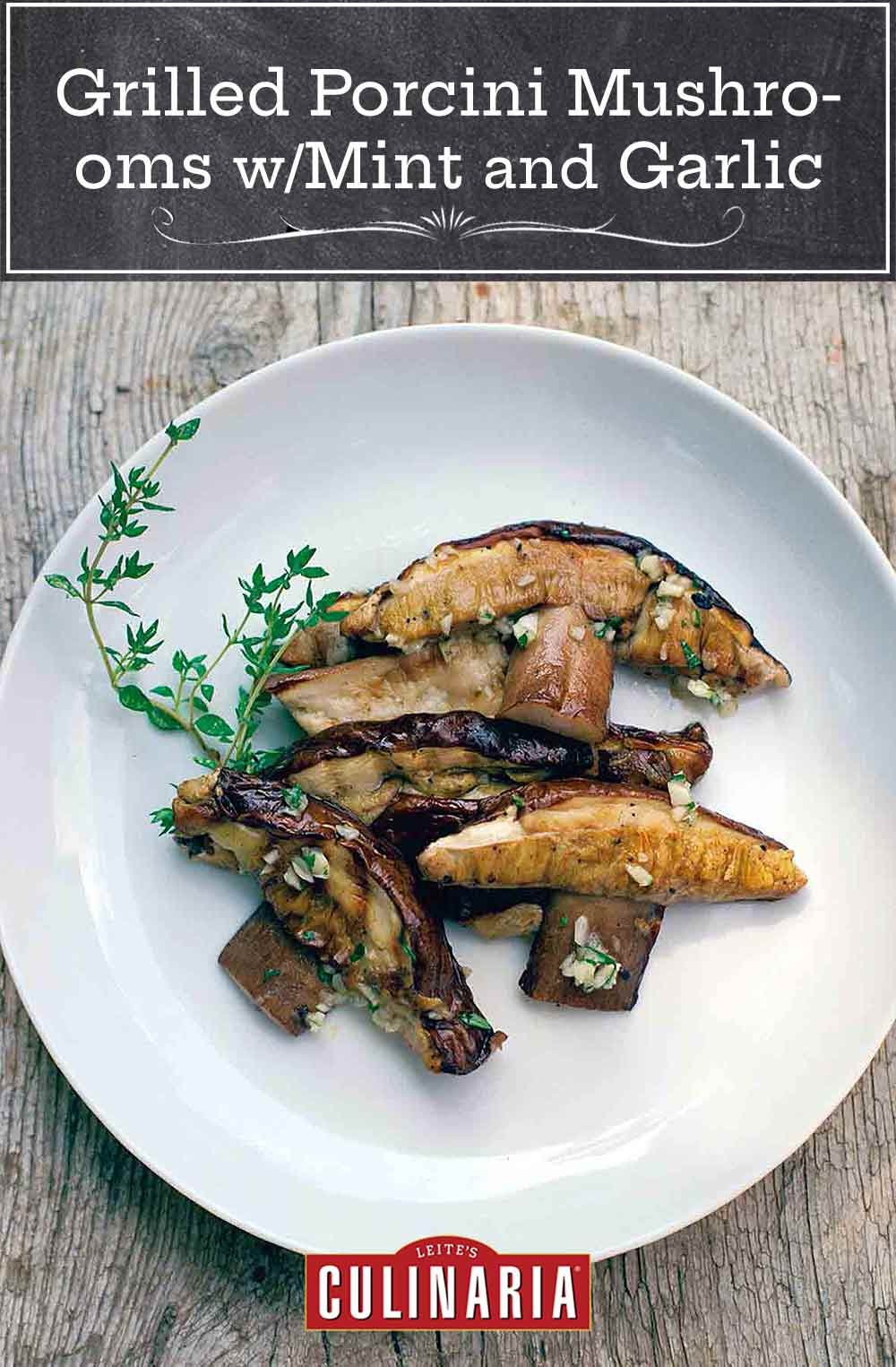 A white plate filled with sliced grilled porcini mushrooms with mint and garlic, garnished with a sprig of thyme.