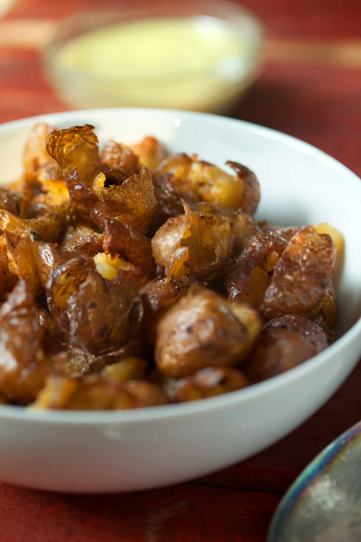 These potatoes are brined, smoked, and then deep-fried to achieve shatteringly crisp skin and meltingly tender interior. #potatoes #smoker #crispy #sidedishrecipes