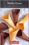 Vanilla and chocolate waffle cones on a white marble surface.