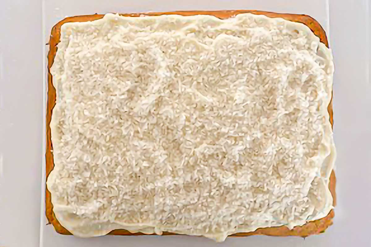 A frosted coconut sheet cake.