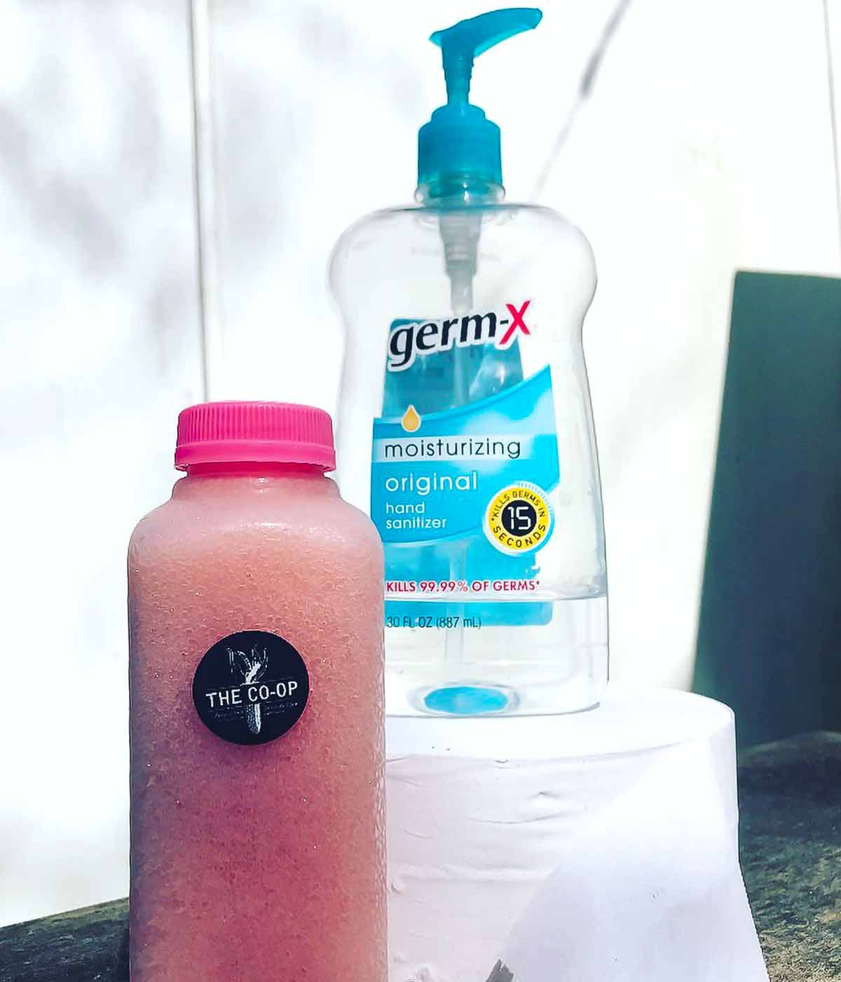 A bottle of Frosé next to a bottle of germ-X sanitizer for the podcast, Talking With My Mouth Full, Ep. 30: Jess Patterson: Frosé King.