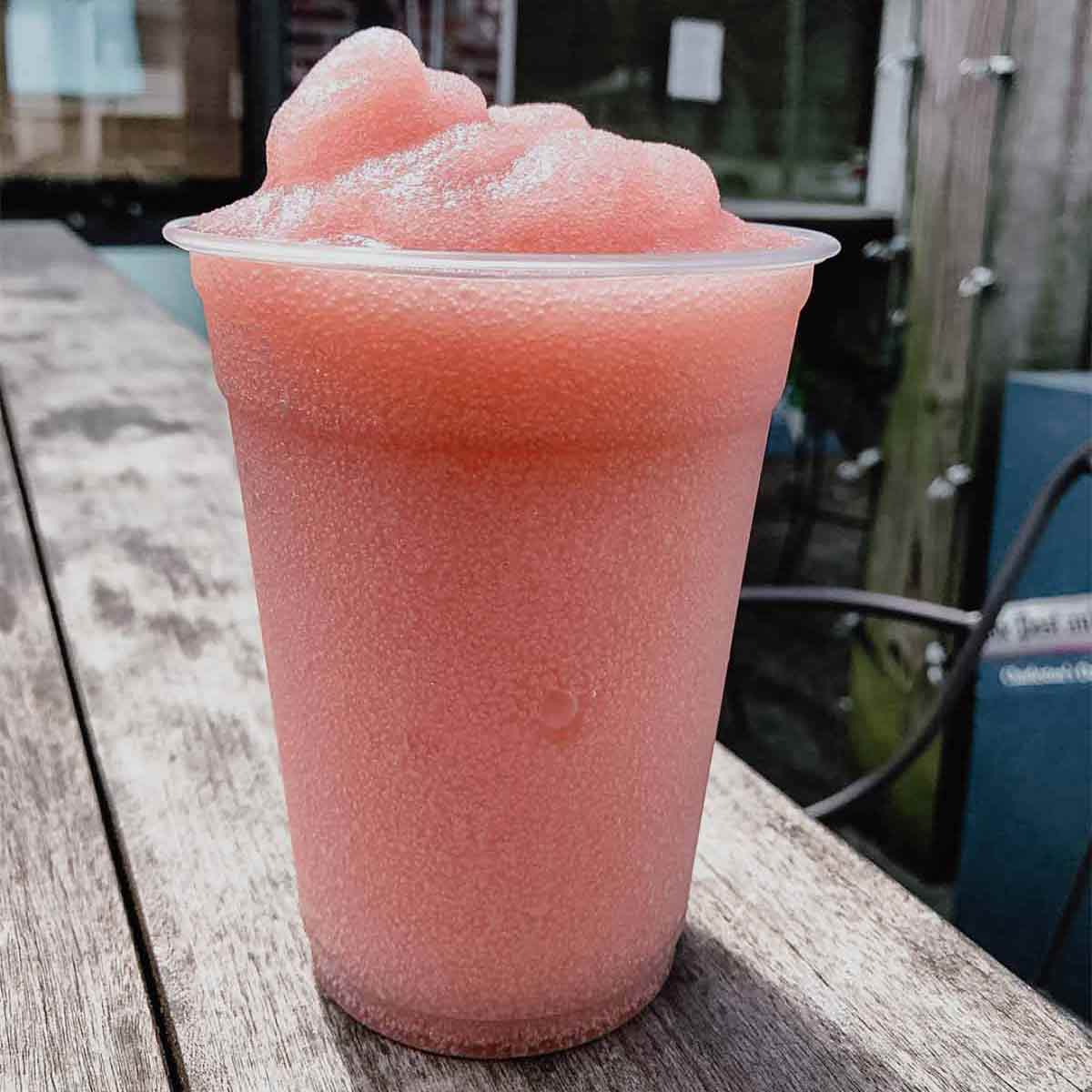 A tall plastic cup filled with Frosé for the podcast, Talking With My Mouth Full, Ep. 30: Jess Patterson: Frosé King.