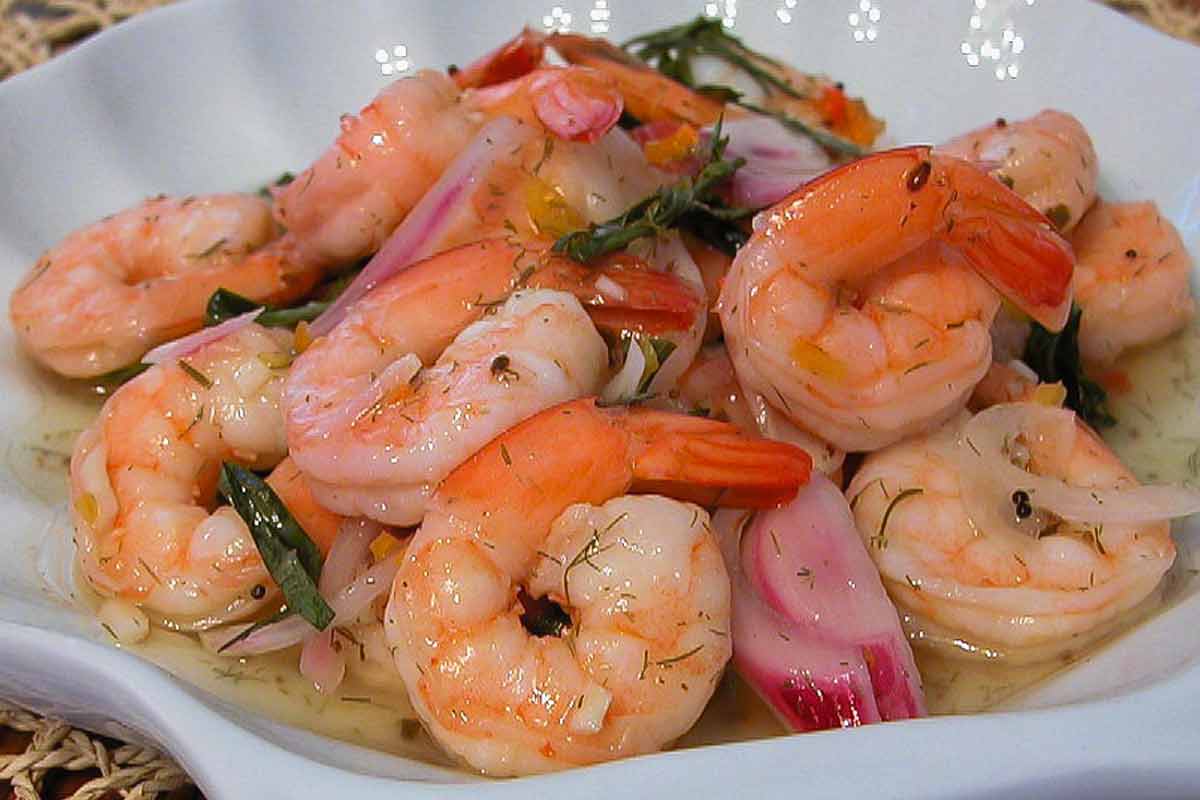 A serving of pickled shrimp in a white bowl.