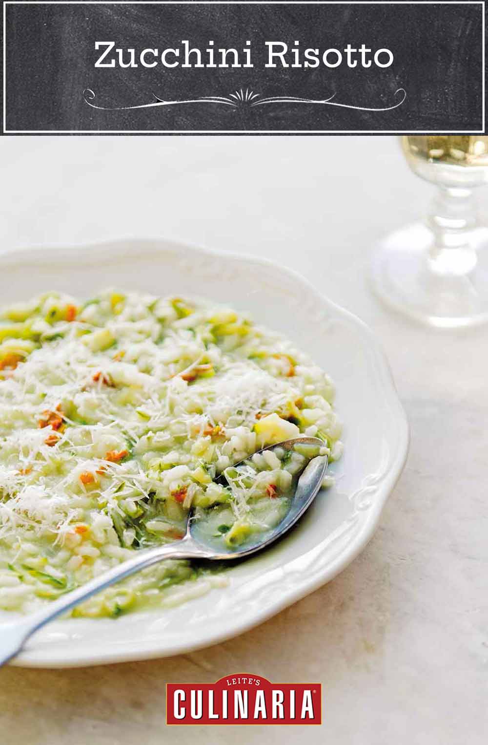 A bowl filled with zucchini risotto and a spoon resting inside.