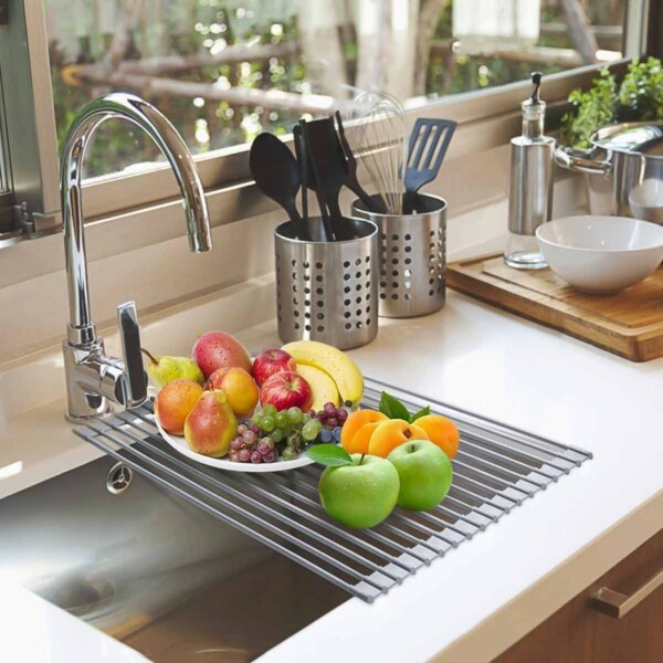 Foldable Multi-Use Drying Mat with fruit on sink.