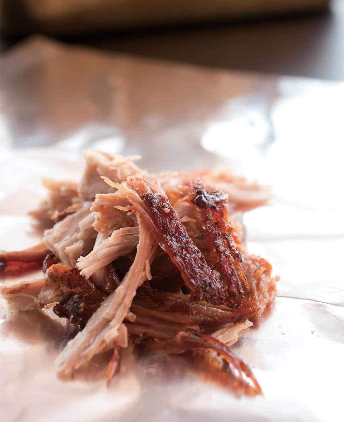 A small pile of shredded slow cooker pulled pork.