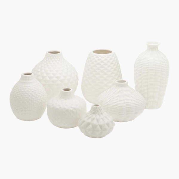 Artisan Carvings Set of 7 Vases with white background.