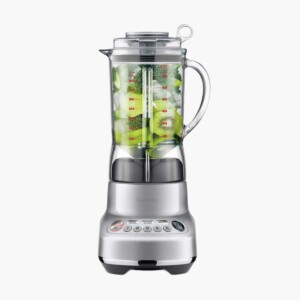 Stainless steel Breville Fresh & Furious Blender filled with kiwi.