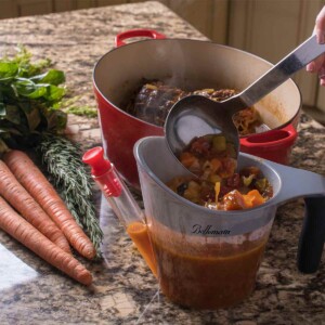 Fat Separator and Measuring Cup shown with carrots to the left.