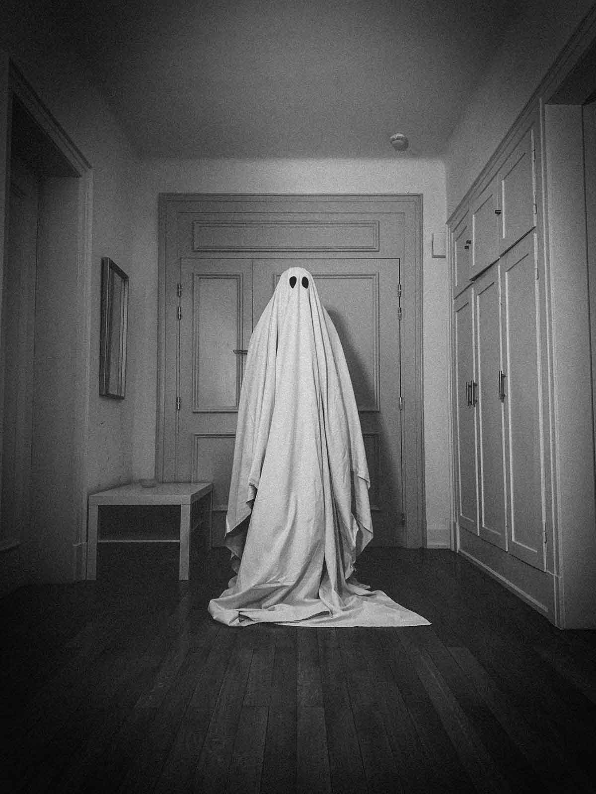 A person dressed as a ghost for Halloween 2020.