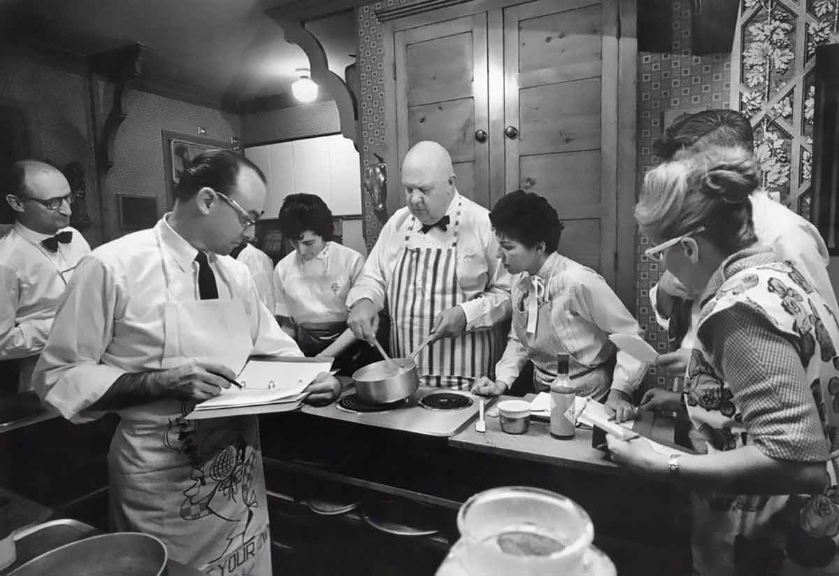 A photograph of James Beard teaching cooking classes, featured in the podcast Talking With My Mouth Full Ep. 34: An Intimate Look at James Beard with John Birdsall.