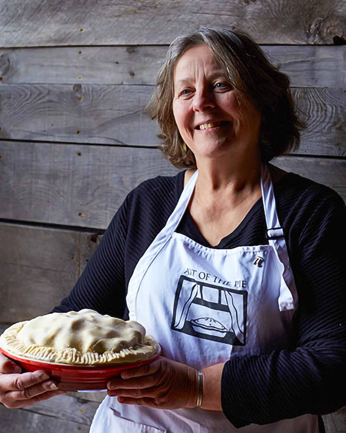 Kate McDermott holding a pie.