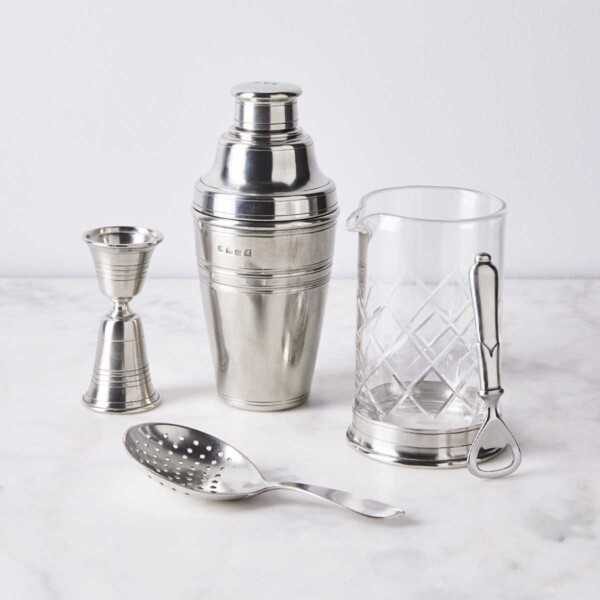 Match Cocktail Mixing Glass with other bar accessories in marble counter.