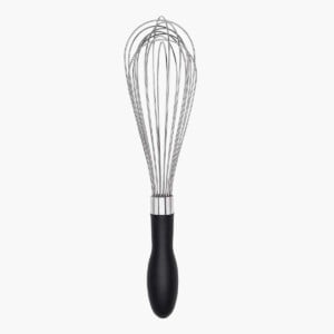 OXO Good Grips Balloon Whisk in use upright with white background.