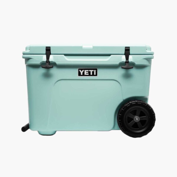 Side view of Yeti Tundra Haul Wheeled Cooler in light blue.