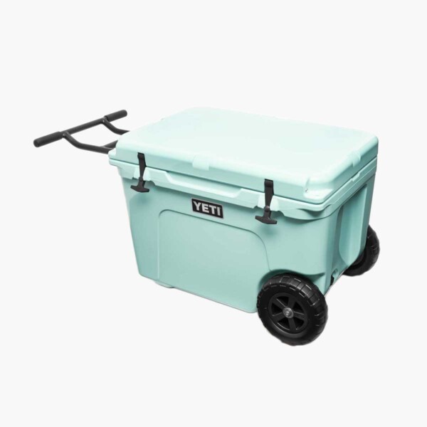 Yeti Tundra Haul Wheeled Cooler in light blue with top shut.