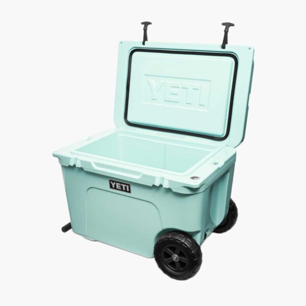 Yeti Tundra Haul Wheeled Cooler in light blue with lid open.