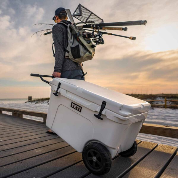 Yeti Tundra Haul Wheeled Cooler in white on a dock.