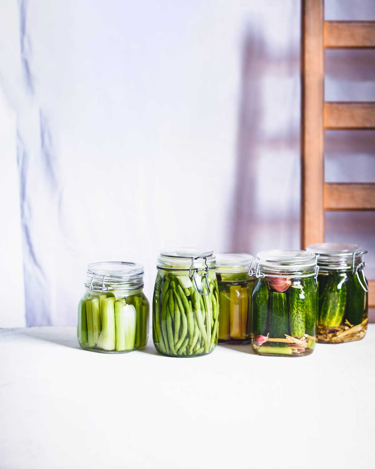 Several jars of pickles to illustrate what (exactly) is fermentation.