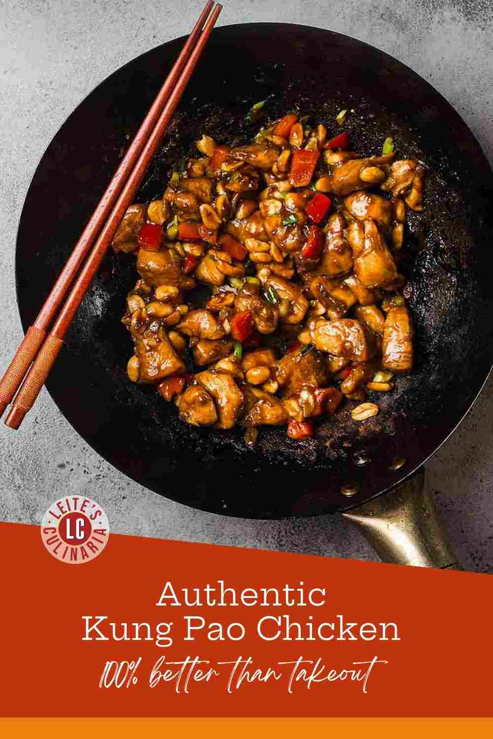 Sizzling Kung Pao chicken with red peppers, peanuts, and green scallions in a dark seasoned wok.