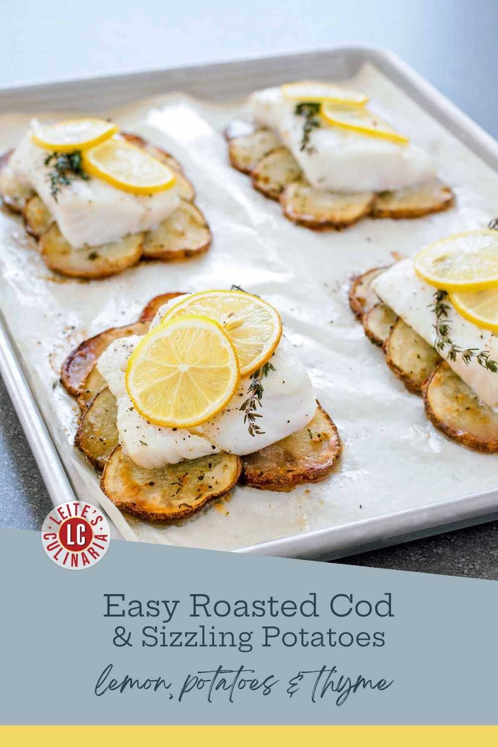 Four servings of roasted cod fillets with lemon slices and thyme, resting on beds of roasted potato rounds on a parchment-lined baking sheet.