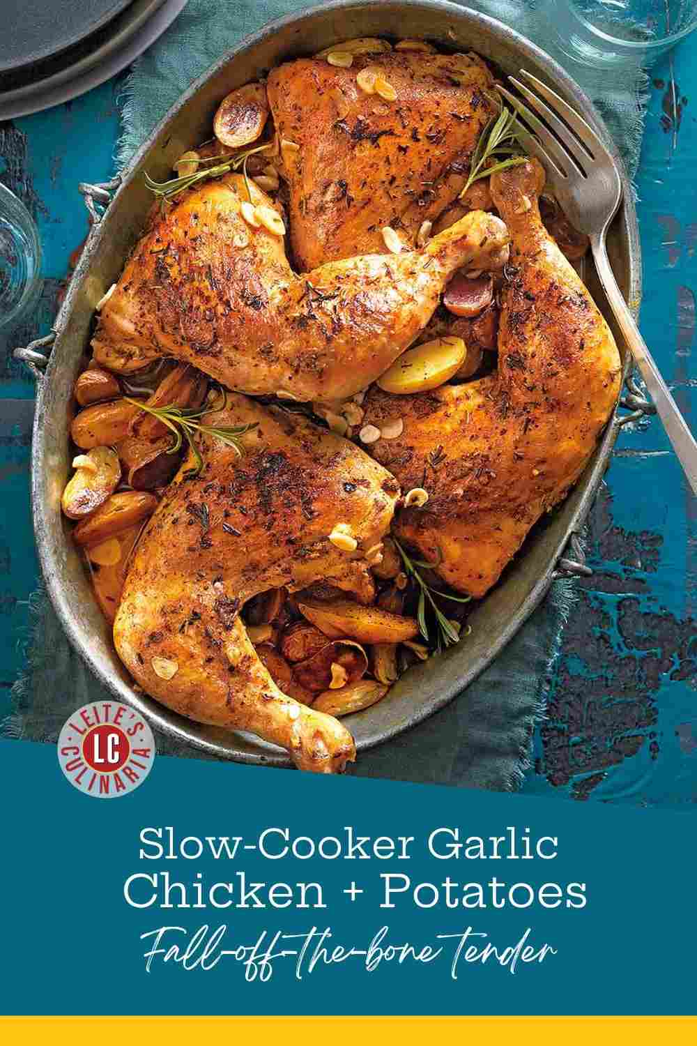 Herb-rubbed roasted chicken leg quarters and golden potatoes in an oval metal pan with rosemary sprigs.