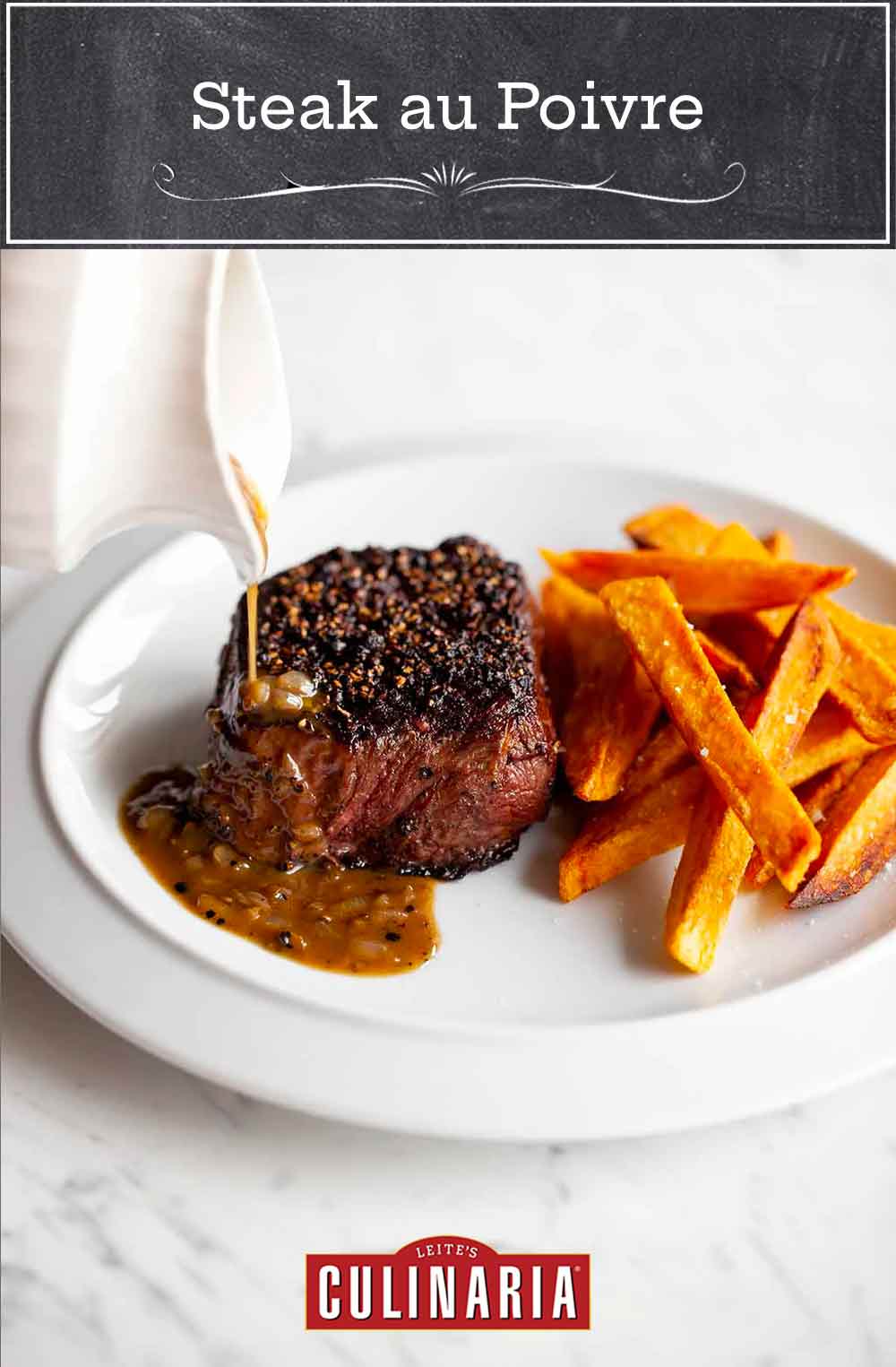 A person drizzling sauce over a steak au poivre on a white plate with sweet potato fries.