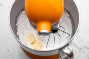 Butter being whipped into Swiss meringue buttercream.