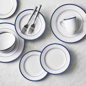 Chez Nous Dinnerware Set in blue on marble counter.
