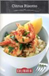 A white bowl of citrus risotto and garlic-chile prawns on a white plate with a fork on the side.