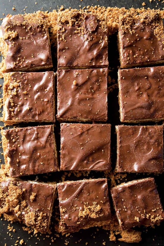 A tray of coconut candy bars cut into squares.