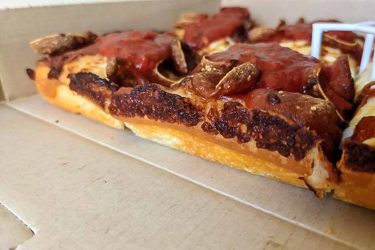 The side view of a Pizza Hut Detroit-style pizza.