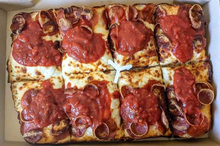 A Pizza Hut Detroit-style pizza cut into 8 squares.