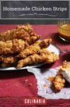 A plate piled with homemade chicken strips and dishes of dipping sauce on the side.